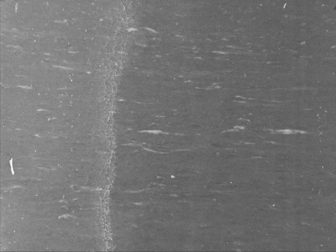 waves raised by wind on the North Atlantic ocean, visibly scratched image tainted by oil of cotoneaster 